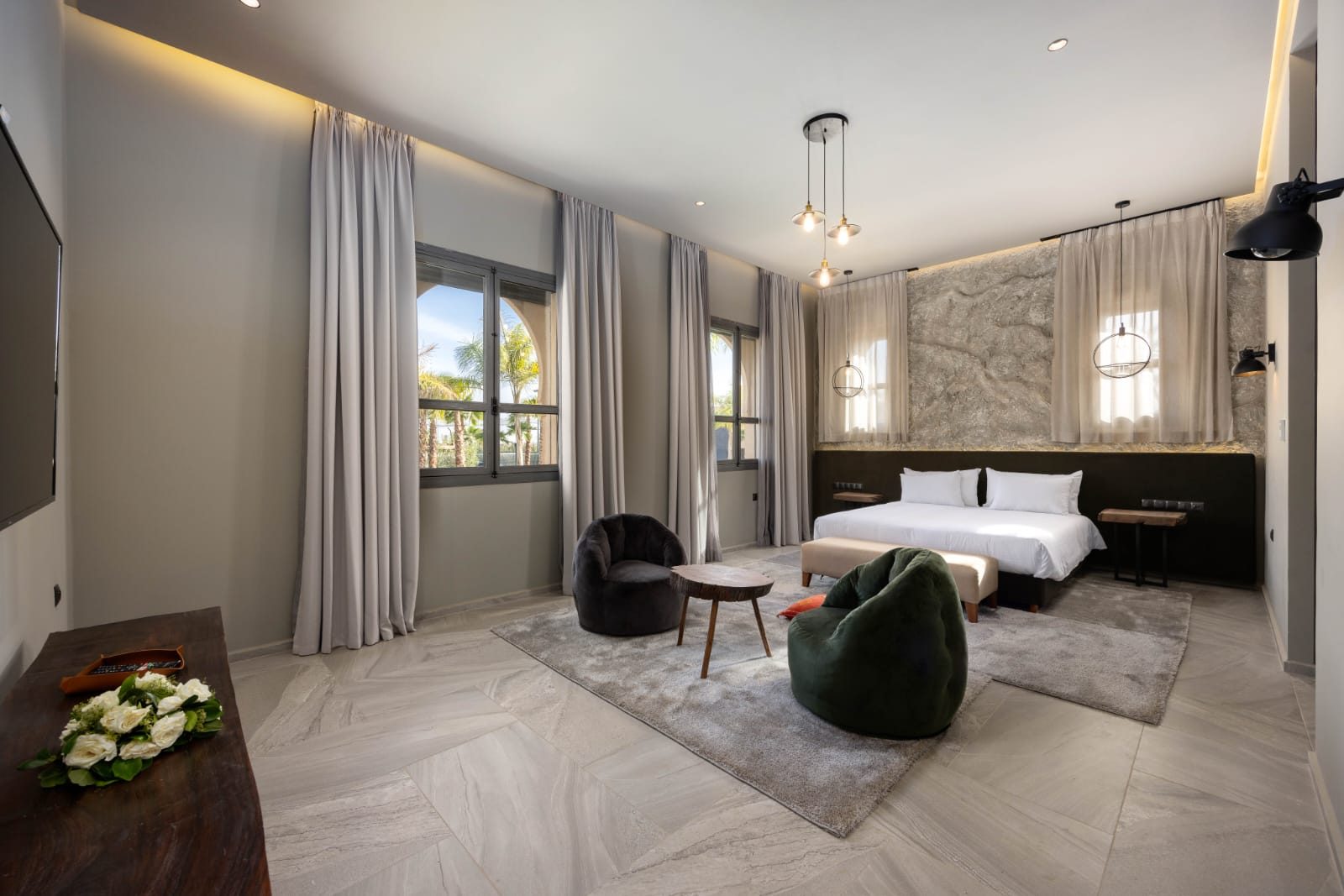 Riad suite with a bed and a sitting area